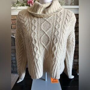 A warm, long sleeve sweater with a cowl neck collar!
